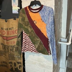 We The Free Patchwork Long Sleeve Tee. Fits snug, so it’s better for a small.